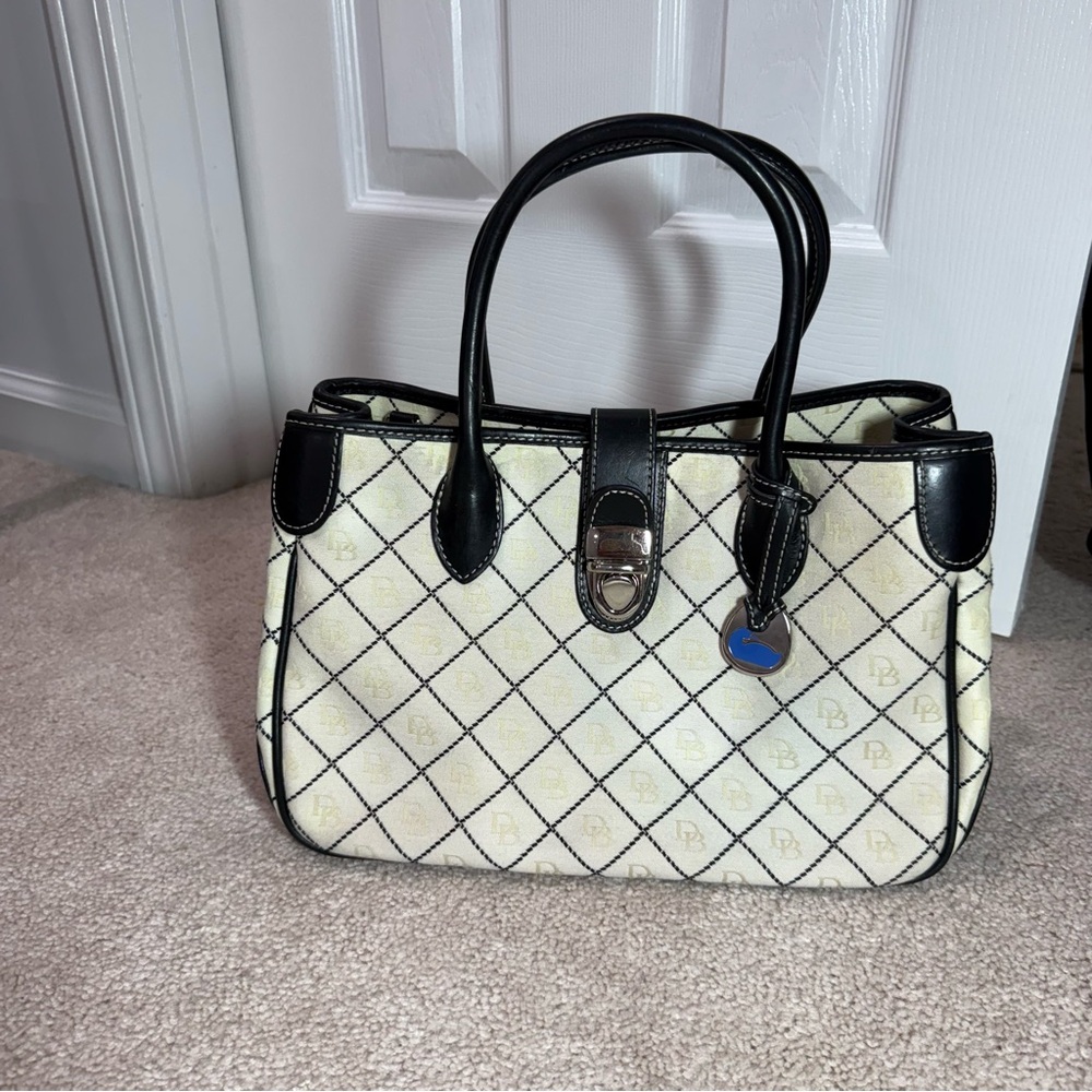 Dooney & Bourke Black and Cream Logo Satchel with blue duck bag charm